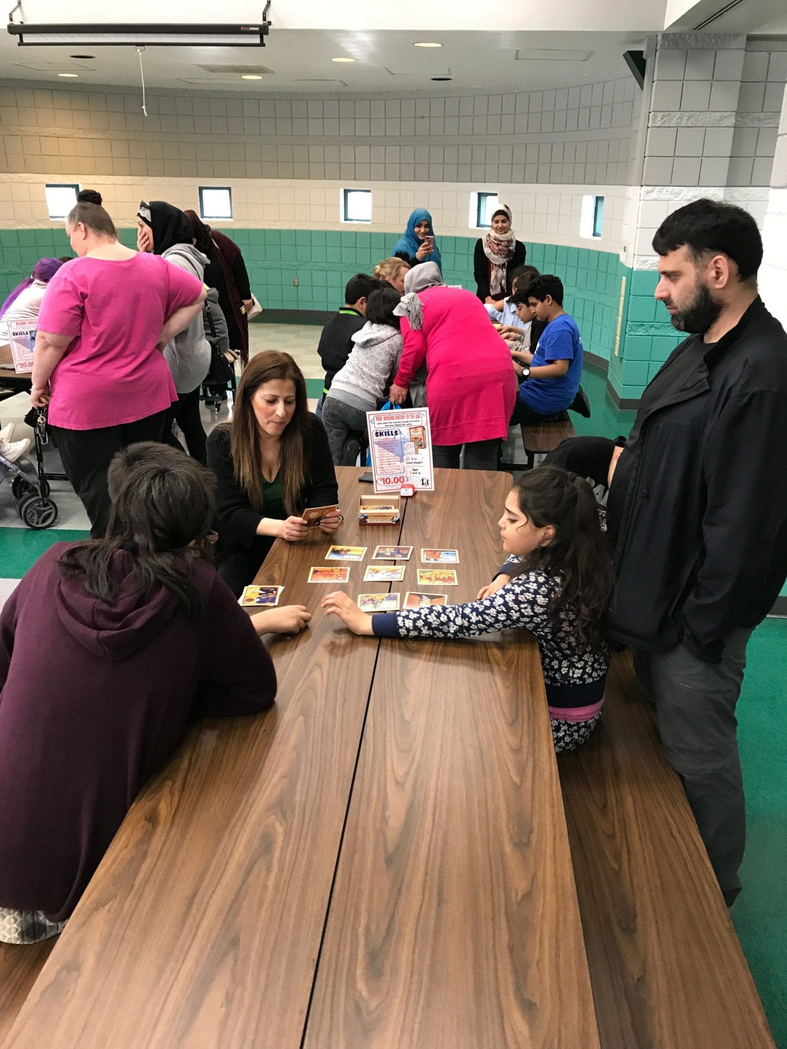 Oakman family playing an educational card game with Ms. Habhab
