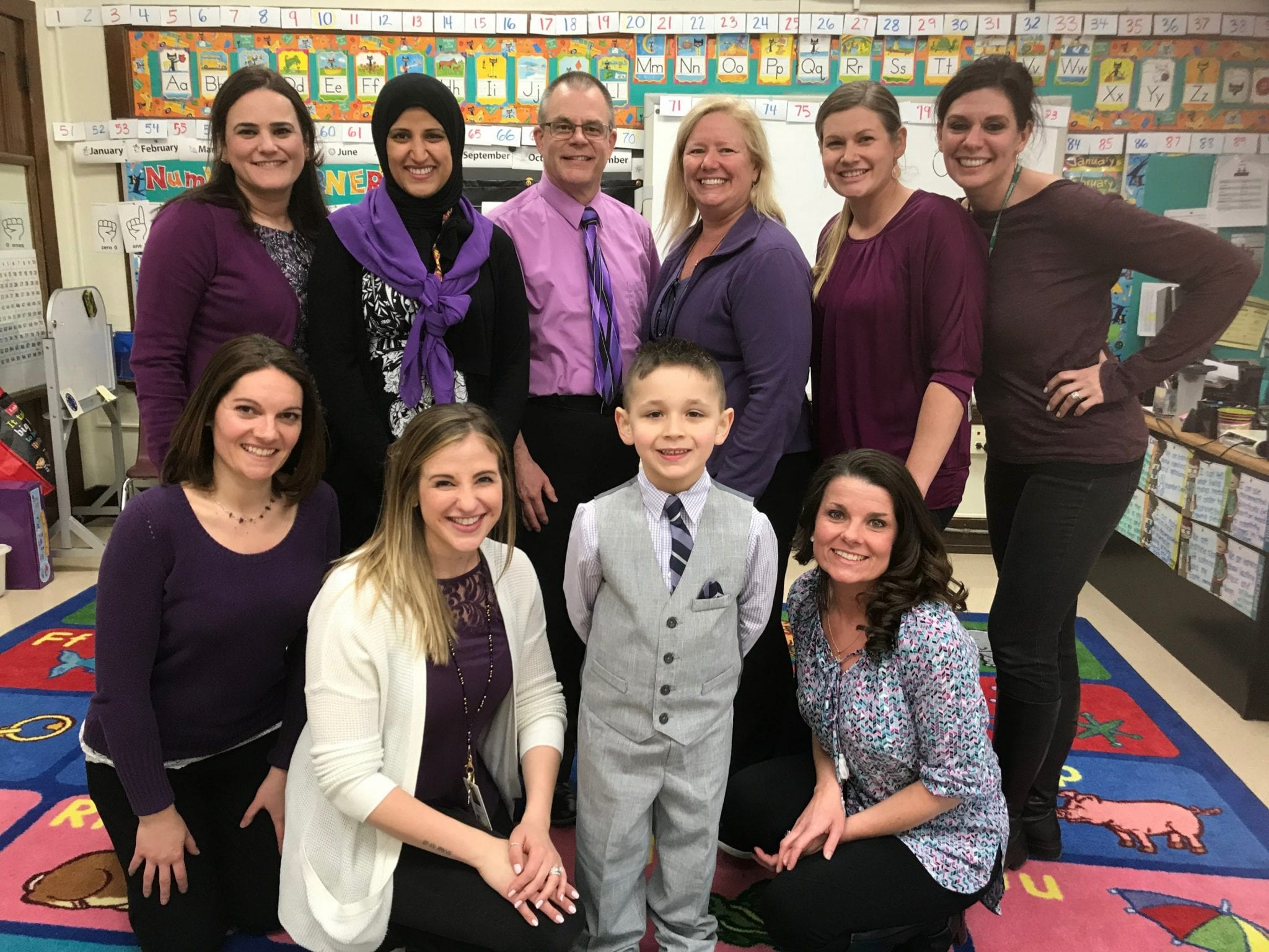 Teachers and student wearing purple 