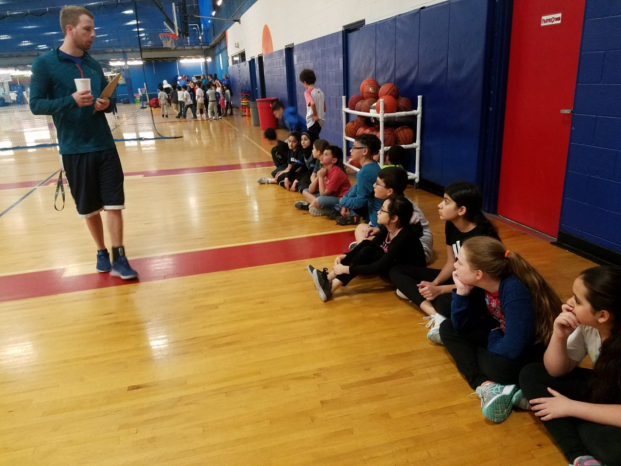 Students listening to directions from their coach