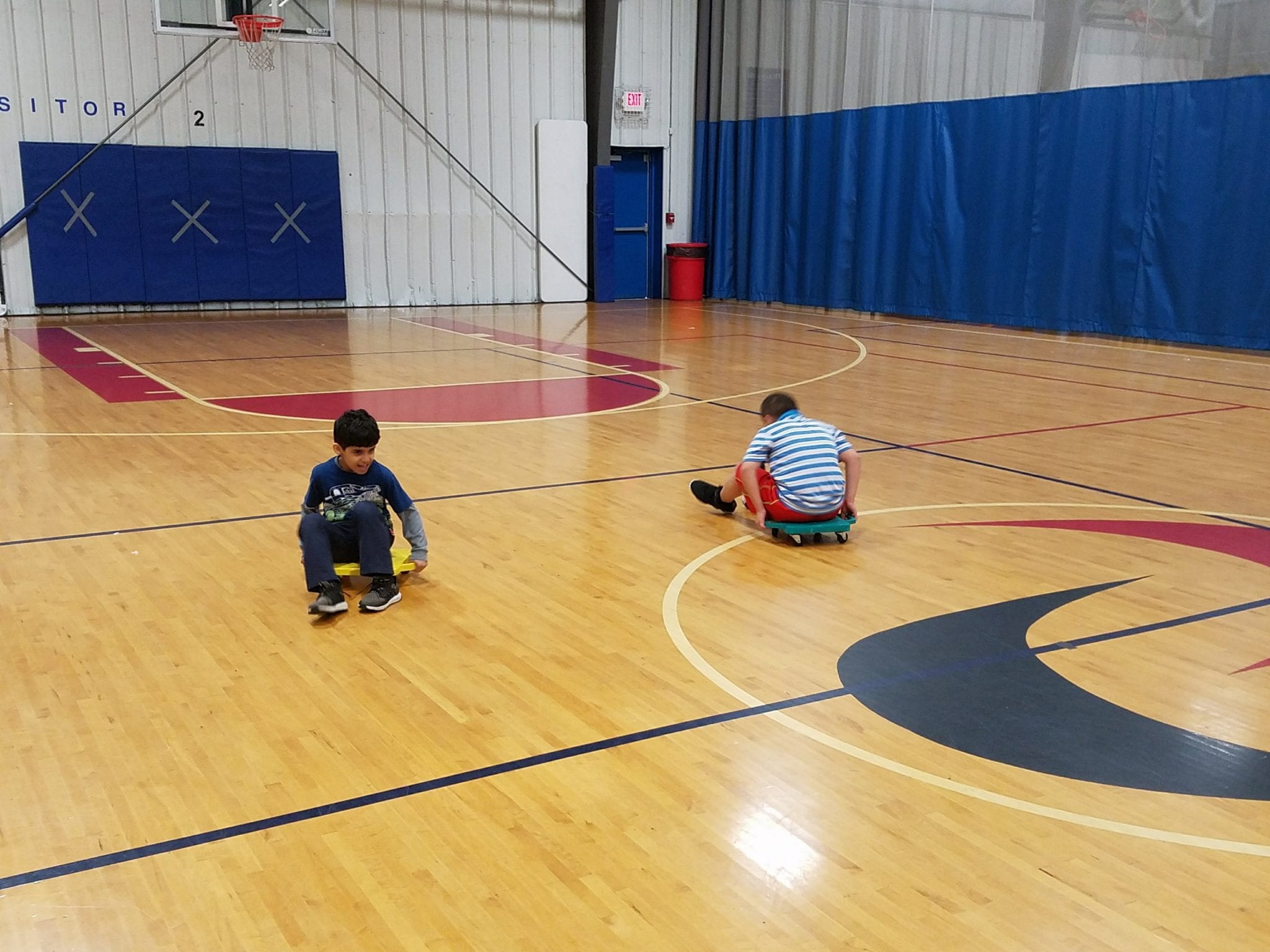 Students rolling around the gym