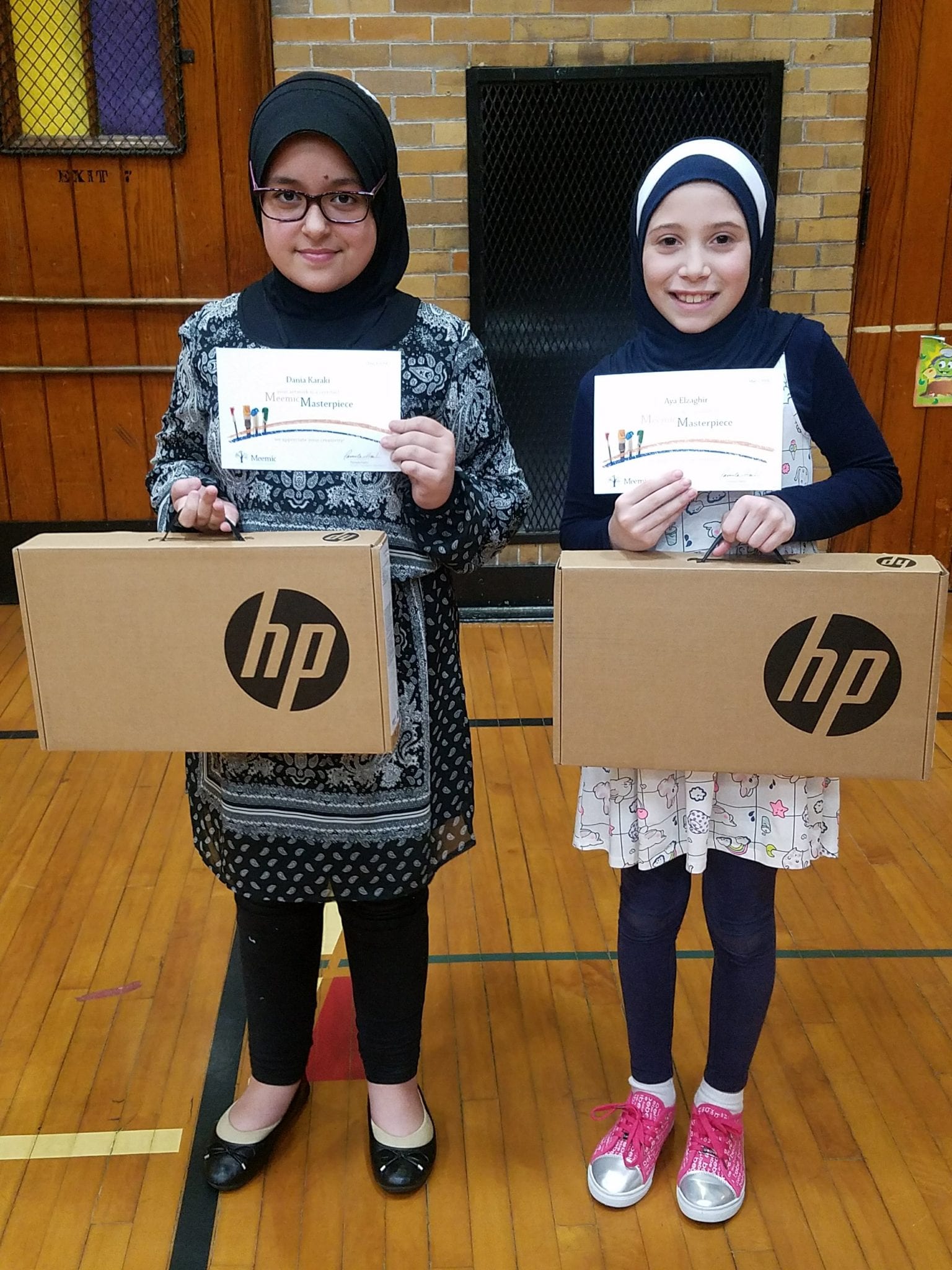 Dania Karaki and Ayah Elzaghir with their HP computer