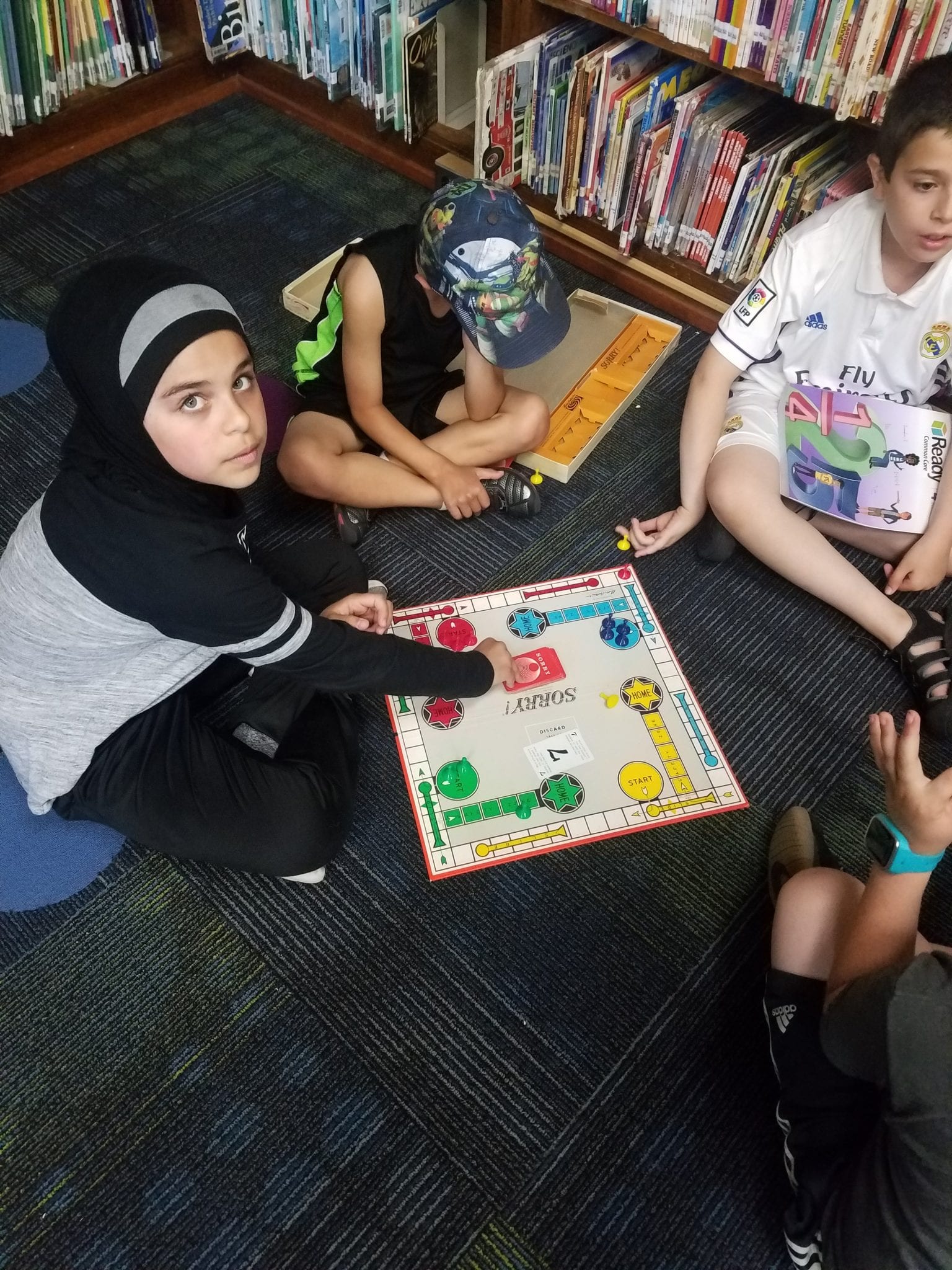 Students playing board games before leaving for the day