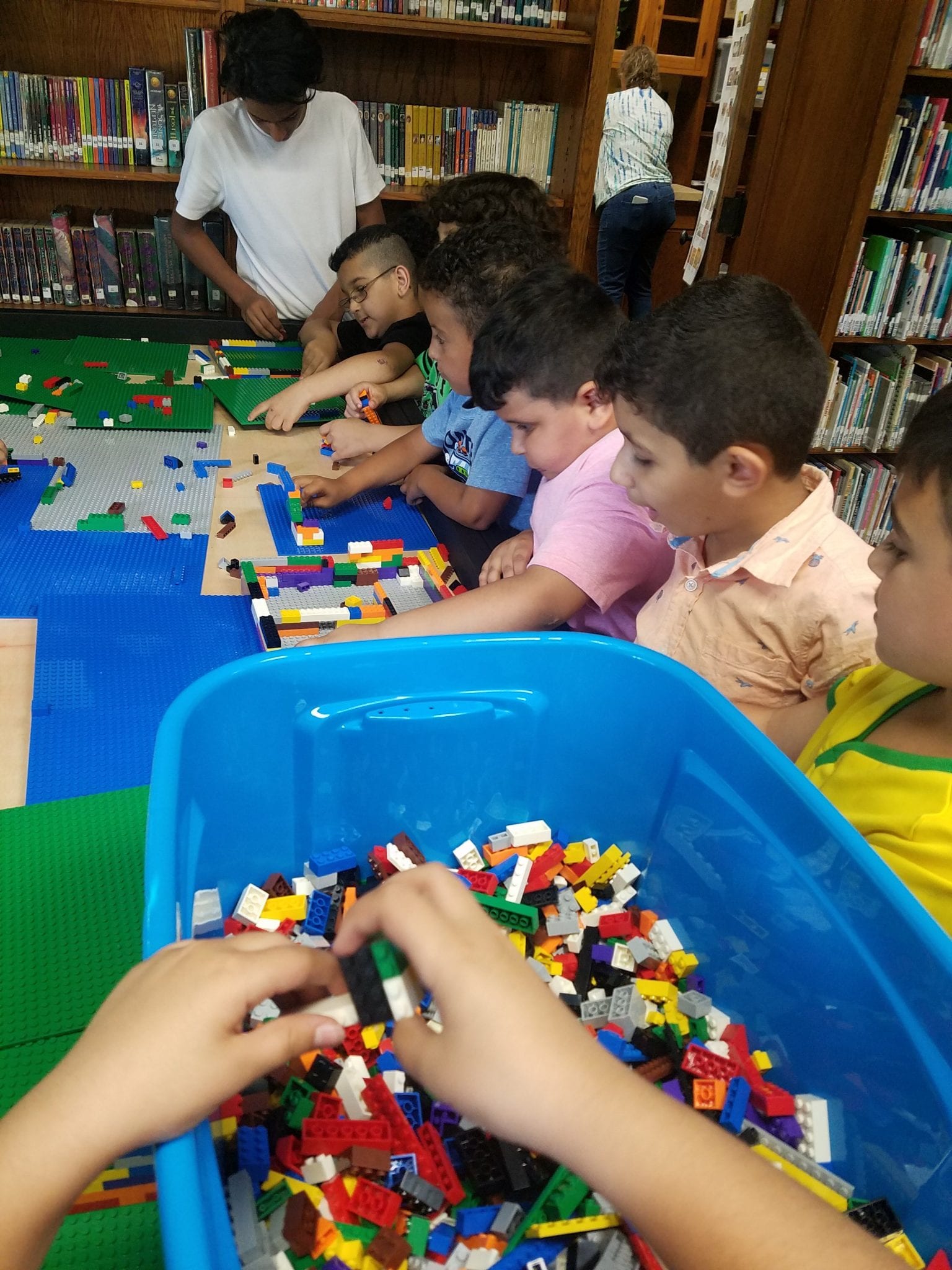 Students enjoying the Lego table