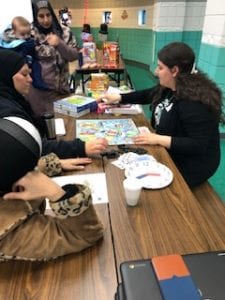 Parents learning about a game with Mrs. Dakhlallah
