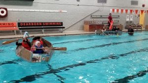 Students have boats in the pool.