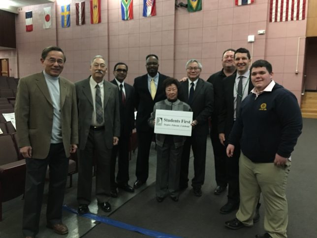 A picture with dignitaries prior to the Korematsu celebration. The sign is present. 