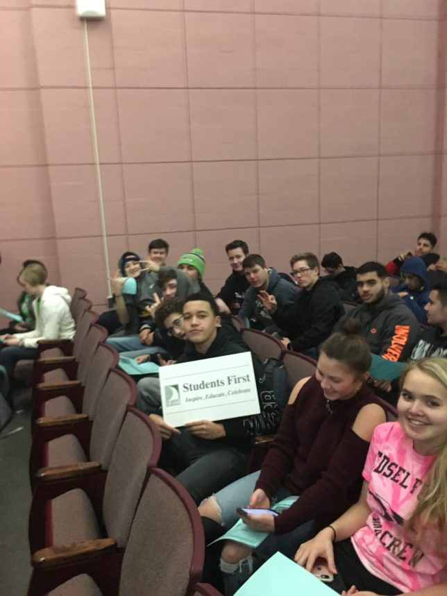 Students getting ready for the Korematsu celebration and holding the Vision sign