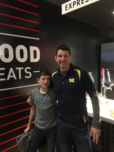 Superintendent and his son at Little Caesars Arena. 