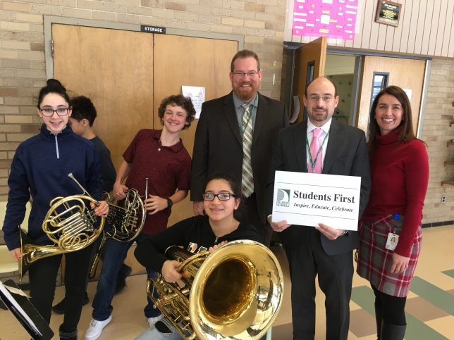 Students with the vision sign holding instruments, the principal, Trustee Thorpe and Marla in the picture