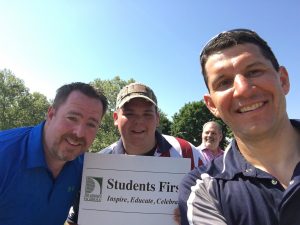 3 adults and a selfie at the parade