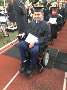 Edsel Ford Graduation students walking and rolling on wheel chairs