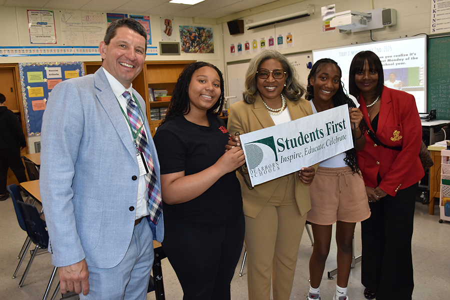 Two O.L. Smith Middle School students pose with Dearborn Public Schools Dr. Superintendent Glenn Maleyko (left), Michigan State Board of Education President Dr. Pamela Pugh (center), and Wayne RESA Superintendent Dr. Daveda Colbert (right)