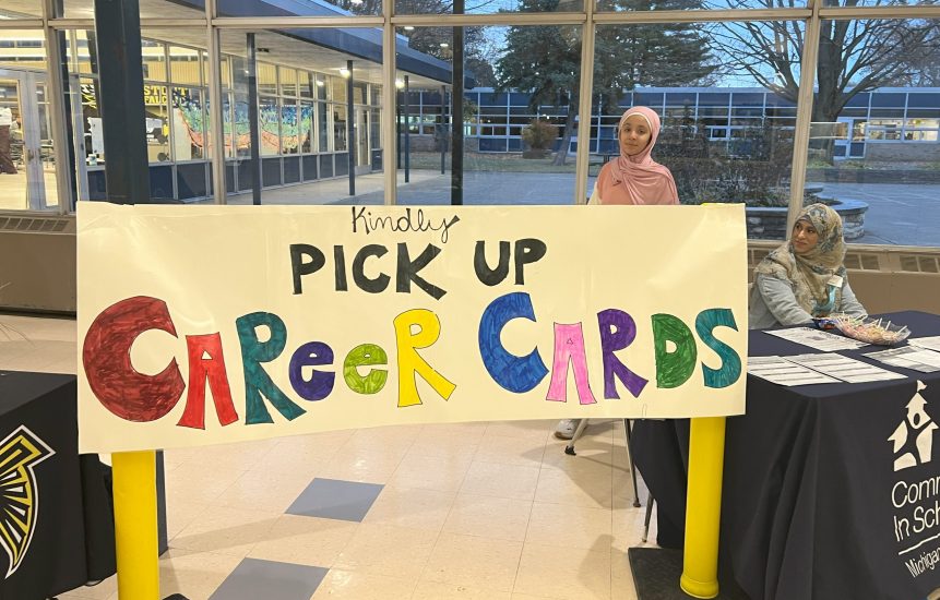 A homemade sign encourage students to pick up career cards.