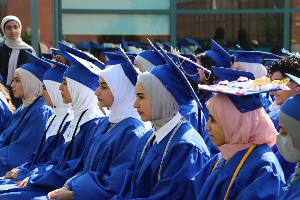 A group of Virtual K-12 students sit during their 2025 graduation ceremony.