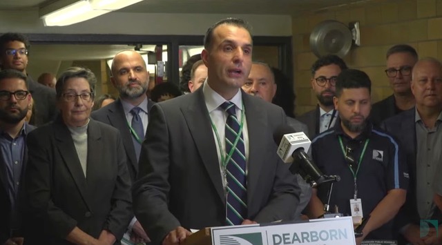 Superintendent Mike Esseily speaks while surrounded by other officials during a press conference at Lowrey School.