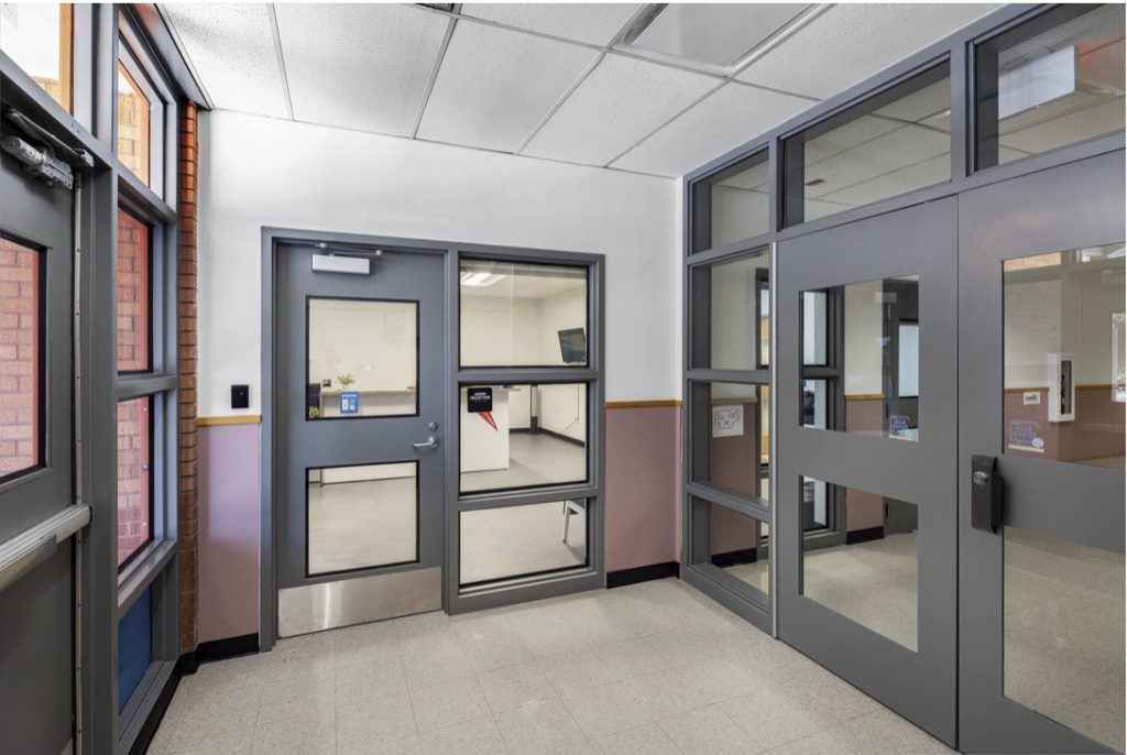 A secure vestibule with a door to the office between the outside and inside vestibule doors.