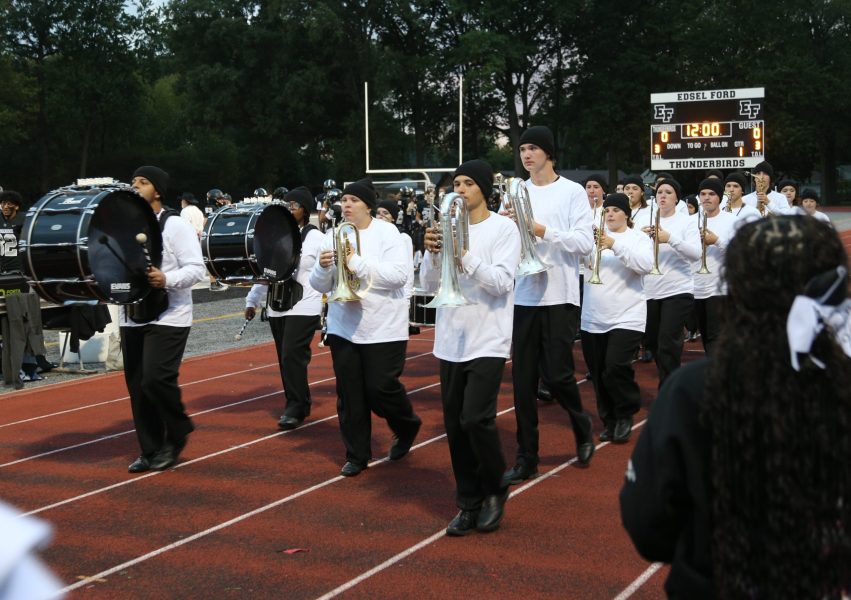 Edsel Ford High's marching band performs before the 2025 homecoming game.